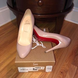 Lightly worn Louboutin nude leather heels